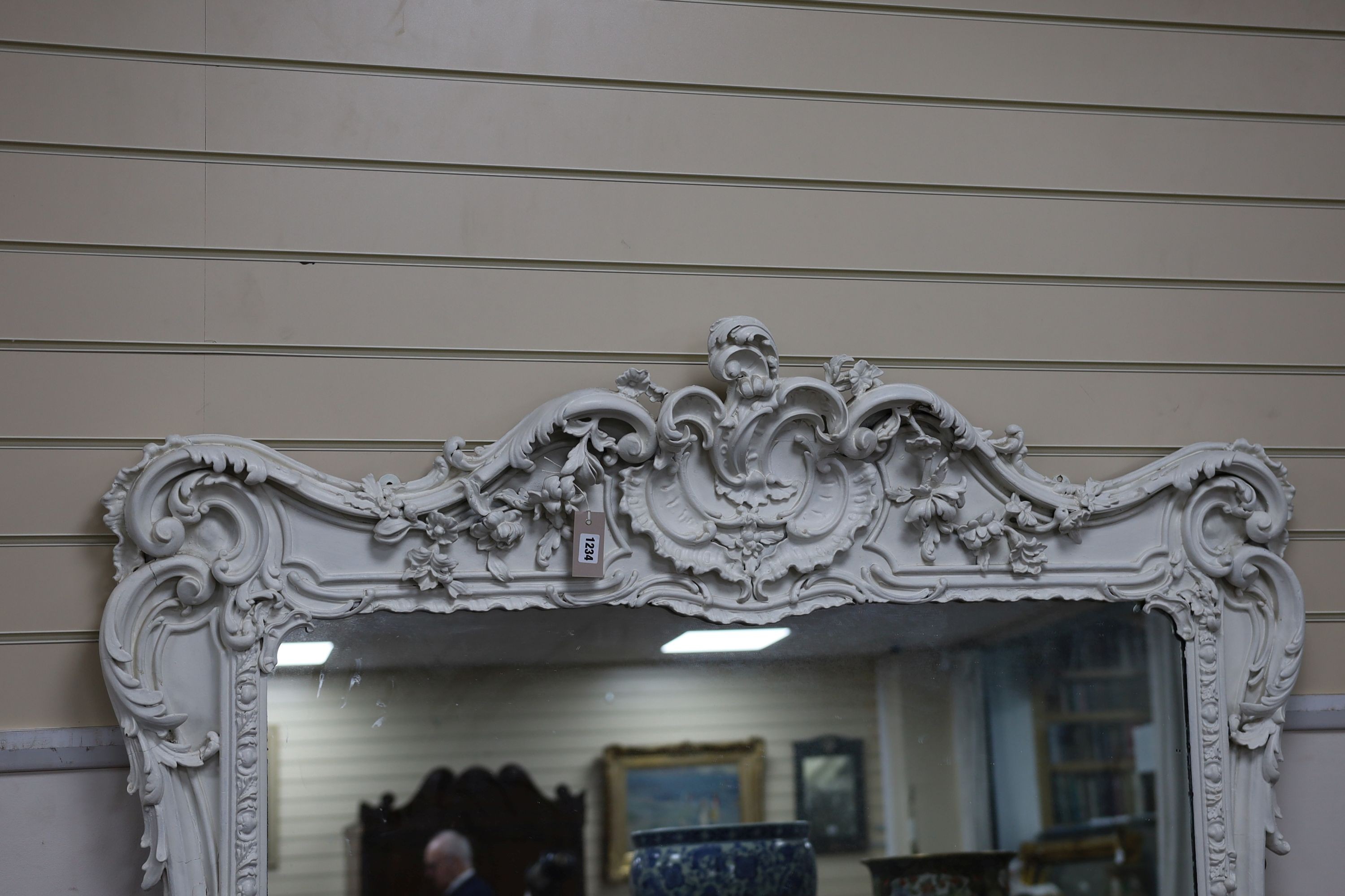 A Victorian carved giltwood and gesso overmantel mirror, later painted white, width 138cm, height 177cm